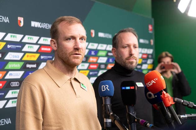 Media round with managing director Michael Ströll black sweater and sports director Benjamin Weber light sweater after the dismissal of Sandro WagnerMedia round with managing director Michael Ströll dark sweater and sports director Benjamin Weber light sweater after the dismissal of Sandro Wagner