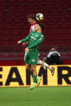 AMSTERDAM , 02-12-2025 , JohanCruyff Arena , season 2025 2026 , Dutch Eredivisie Football , match between Ajax and FC Groningen (replay) , Picture shows , Ajax player Youri Baas, .FC Groningen player Thom van Bergen Ajax - Groningen (replay)  x32312989x Copyright: