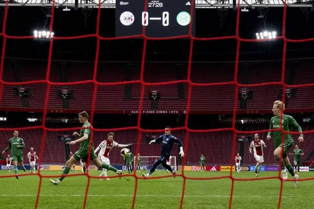 AMSTERDAM - Mika Godts of Ajax scores the 1-0 during the Dutch Eredivisie match between AFC Ajax and FC Groningen at the Johan Cruijff ArenA on December 2, 2025, in Amsterdam, Netherlands. The match was abandoned after supporters set off fireworks twice and threw them onto the pitch. ANP OLAF KRAAK Eredivisie 2025-2026 xVIxANPxSportx xxANPxIVx 543679126 originalFilename: 543679126.jpg