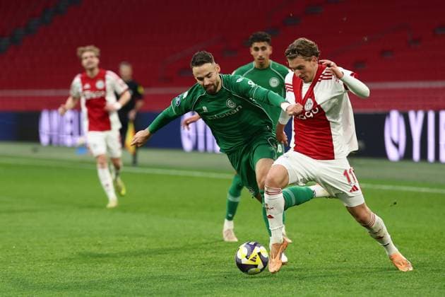 AMSTERDAM , 02-12-2025 , JohanCruyff Arena , season 2025 2026 , Dutch Eredivisie Football , match between Ajax and FC Groningen (replay) , Picture shows , FC Groningen player Marco Rente, .Ajax player Mika Godts Ajax - Groningen (replay)  x32313333x Copyright: