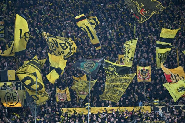 02 12 2025, xjhx, Fußball DFB Pokal Achtelfinale, Borussia Dortmund Bayer 04 Leverkusen emspor, v l symbol photo, symbol image, symbol fans, spectators, audience, Tribuene Südkurve Fahnen DFL DFB REGULATIONS PROHIBIT ANY USE OF PHOTOGRAPHS as IMAGE SEQUENCES and or QUASI VIDEO Dortmund