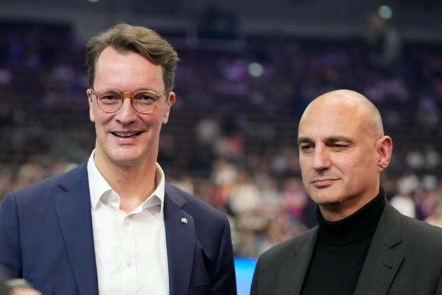 Hendrik Josef Wüst Minister President of the State of North Rhine-Westphalia and Alexander Kalouti Lord Mayor of the City of Dortmund looks on during the 27th IHF Women s Handball World Championship Main Round match between Germany and Faroe Islands at Westfalenhalle on December 2, 2025 in Dortmund, Germany Photo by Alex Gottschalk DeFodi Images