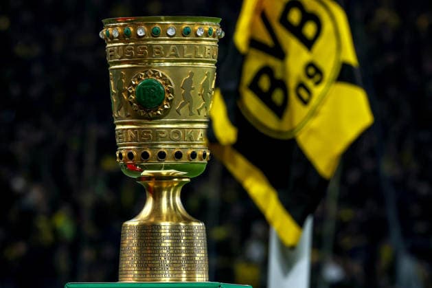 02 12 2025, Football, DFB Cup, Borussia Dortmund Bayer 04 Leverkusen, Round of 16, Signal Iduna Park, Season 2025 2026 The trophy next to the corner flag with logo banner emblem of BVB 09 the trophy in close-up honorary prize detail photo DFB regulations prohibit any use of photographs as image sequences and or quasi video North Rhine-Westphalia Germany