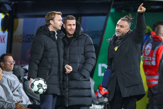 02 12 2025, Football, DFB Cup, Borussia Dortmund Bayer 04 Leverkusen, Round of 16, Signal Iduna Park, Season 2025 2026 Managing Director Simon Rolfes Bayer04 Management next to Sports Director Sebastian Kehl BVB sk laughing good-humored joy together next to Patrick Owomoyela gesticulating right DFB regulations prohibit any use of photographs as image sequences and or quasi video North Rhine-Westphalia Germany