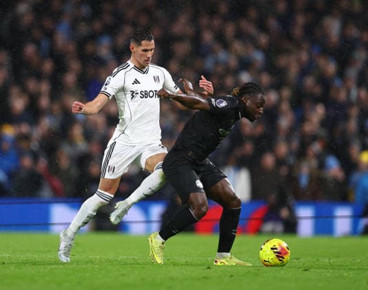 London, England, 2nd December 2025. Sasa Lukic of Fulham (l) and Jeremy Doku of Manchester City (r) during the Fulham vs Manchester City Premier League match at Craven Cottage, London. Picture credit should read: Nigel Roddis Sportimage EDITORIAL USE ONLY. No use with unauthorised audio, video, data, fixture lists, club league logos or live services. Online in-match use limited to 120 images, no video emulation. No use in betting, games or single club league player publications. SPI_022_PT_Fulham_Man_City SPI-4339-0022
