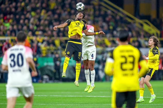 02 12 2025, Football, DFB Cup, Borussia Dortmund Bayer 04 Leverkusen, Round of 16, Signal Iduna Park, Season 2025 2026 Carney Chukwuemeka BVB 17 in duel against Jarell Quansah Bayer04 04 DFB regulations prohibit any use of photographs as image sequences and or quasi video North Rhine-Westphalia Germany