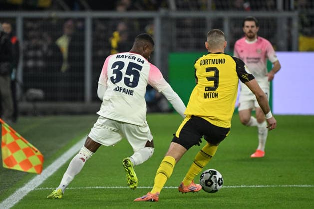 02 12 2025, xjhx, Football DFB Cup Round of 16, Borussia Dortmund Bayer 04 Leverkusen emspor, v l Christian Michel Kofane Leverkusen, 35 , Waldemar Anton Dortmund, 3 DFL DFB REGULATIONS PROHIBIT ANY USE OF PHOTOGRAPHS as IMAGE SEQUENCES and or QUASI VIDEO Dortmund