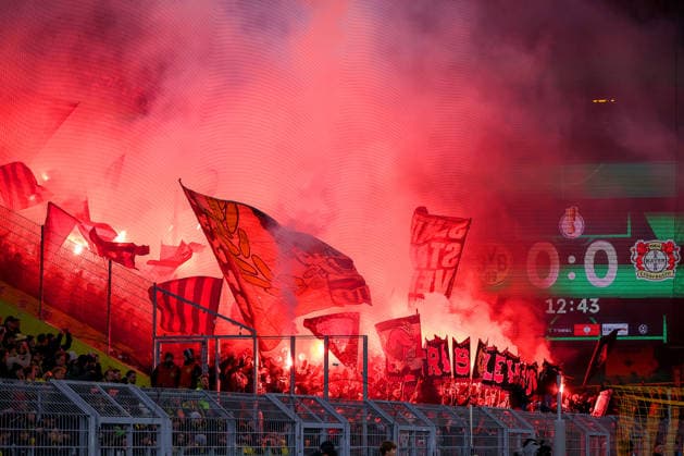 02 12 2025, Football, DFB Cup, Borussia Dortmund Bayer 04 Leverkusen, Round of 16, Signal Iduna Park, Season 2025 2026 Choreography Choreo Choreography in the fan curve in the first half Leverkusen Ultras ignite Bengal fire Pyrotechnics Benaglos DFB regulations prohibit any use of photographs as image sequences and or quasi video North Rhine-Westphalia Germany