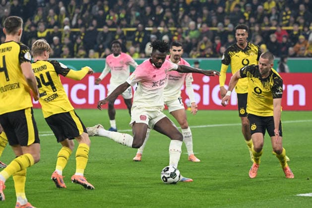 02 12 2025, xjhx, Football DFB Cup Round of 16, Borussia Dortmund Bayer 04 Leverkusen emspor, v l Edmond Tapsoba Leverkusen, 12 shoots the ball on goal, shot on goal, shot DFL DFB REGULATIONS PROHIBIT ANY USE OF PHOTOGRAPHS as IMAGE SEQUENCES and or QUASI VIDEO Dortmund