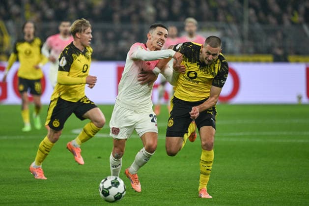 02 12 2025, xjhx, Football DFB Cup Round of 16, Borussia Dortmund Bayer 04 Leverkusen emspor, v l Alejandro Grimaldo Leverkusen, 20 , Waldemar Anton Dortmund, 3 duel, duel, fight, tackle DFL DFB REGULATIONS PROHIBIT ANY USE OF PHOTOGRAPHS as IMAGE SEQUENCES and or QUASI VIDEO Dortmund