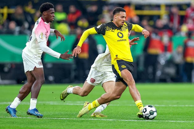 02 12 2025, Football, DFB Cup, Borussia Dortmund Bayer 04 Leverkusen, Round of 16, Signal Iduna Park, Season 2025 2026 Felix Nmecha BVB 08 in a duel against Ibrahim Maza Bayer04 30 DFB regulations prohibit any use of photographs as image sequences and or quasi video North Rhine-Westphalia Germany
