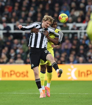 Newcastle Upon Tyne, England, 2nd December 2025. Nick Woltemade (L) of Newcastle United in action with Kevin Danso of Tottenham Hotspur during the Newcastle United vs Tottenham Hotspur Premier League match at St. James Park, Newcastle Upon Tyne. Picture credit should read: Nigel Roddis Sportimage EDITORIAL USE ONLY. No use with unauthorised audio, video, data, fixture lists, club league logos or live services. Online in-match use limited to 120 images, no video emulation. No use in betting, games or single club league player publications. SPI_023_NR_NEWC_TOTT SPI-4340-0023