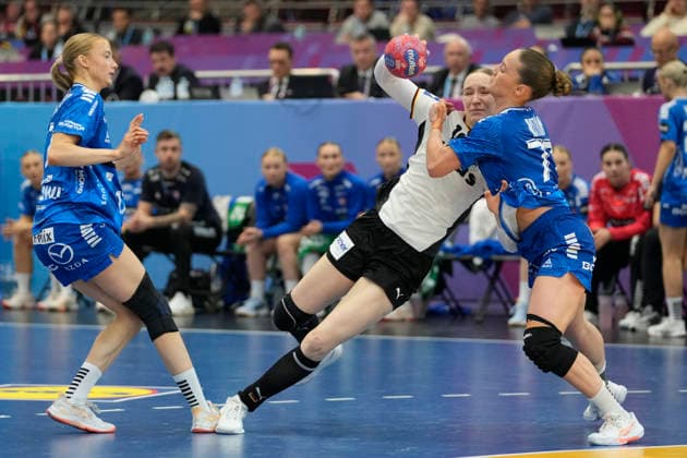 Nieke Kühne Germany and Jana Mittun Faroe Islands battle for the ball during the 27th IHF Women s Handball World Championship Main Round match between Germany and Faroe Islands at Westfalenhalle on December 2, 2025 in Dortmund, Germany Photo by Alex Gottschalk DeFodi Images