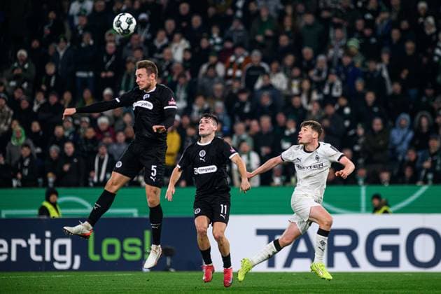 MOENCHENGLADBACH, GERMANY - 2 DECEMBER, 2025: Hauke Wahl, Arkadiusz Pyrka, Lukas Ullrich - The DFB Pokal, German Cup, match Borussia vs St.Pauli at Borussia Park.  Copyright: xVitaliixKliuievx