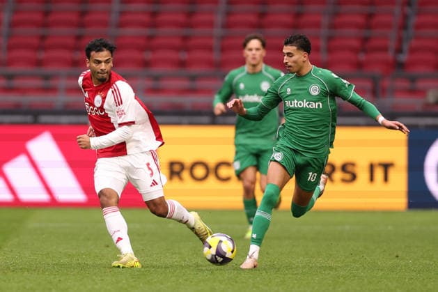 Owen Wijndal of AFC Ajax with Younes Taha El Idrissi of FC Groningen during the match AFC Ajax Amsterdam vs FC Groningen at the Johan Cruijff ArenA for the Dutch Vriendenloterij Eredivisie season 2025 2026 in AMSTERDAM, Netherlands on 1 december 2025, photo by Peter Lous EYE4images DeFodi Images