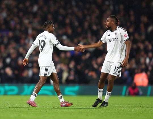 London, England, 2nd December 2025. Samuel Chukwueze of Fulham (l) celebrates scoring their fourth goal during the Fulham vs Manchester City Premier League match at Craven Cottage, London. Picture credit should read: Paul Terry Sportimage EDITORIAL USE ONLY. No use with unauthorised audio, video, data, fixture lists, club league logos or live services. Online in-match use limited to 120 images, no video emulation. No use in betting, games or single club league player publications. SPI_056_PT_Fulham_Man_City SPI-4339-0054