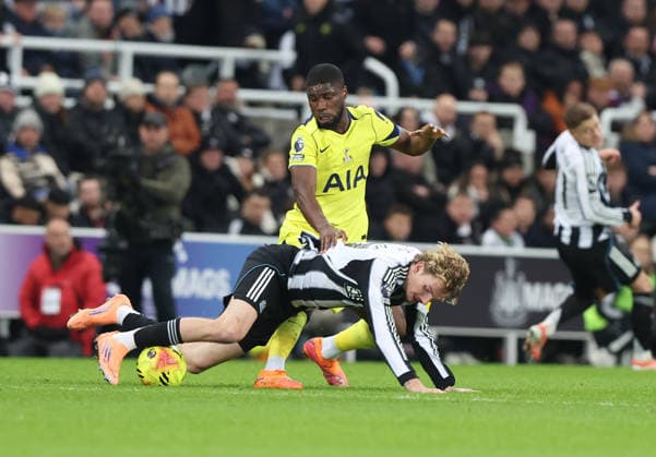 Newcastle Upon Tyne, England, 2nd December 2025. Nick Woltemade (L) of Newcastle United in action with Kevin Danso of Tottenham Hotspur during the Newcastle United vs Tottenham Hotspur Premier League match at St. James Park, Newcastle Upon Tyne. Picture credit should read: Nigel Roddis Sportimage EDITORIAL USE ONLY. No use with unauthorised audio, video, data, fixture lists, club league logos or live services. Online in-match use limited to 120 images, no video emulation. No use in betting, games or single club league player publications. SPI_031_NR_NEWC_TOTT SPI-4340-0031