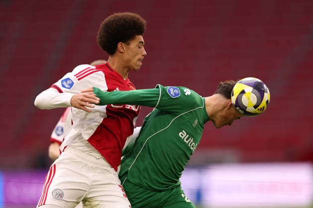 Aaron Bouwman of AFC Ajax battles for the ball with Thom van Bergen of FC Groningen during the match AFC Ajax Amsterdam vs FC Groningen at the Johan Cruijff ArenA for the Dutch Vriendenloterij Eredivisie season 2025 2026 in AMSTERDAM, Netherlands on 1 december 2025, photo by Peter Lous EYE4images DeFodi Images