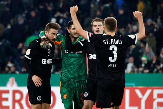Mönchengladbach, Germany, Germany DFB Pokal Round of 16 Borussia Mönchengladbach FC St Pauli 1 2 Hauke Finn WAHL STP , goalkeeper Nikola VASILJ STP , Eric SMITH STP and Karol METS STP from left to right celebrate the victory Photo Norbert Schmidt, Duesseldorf