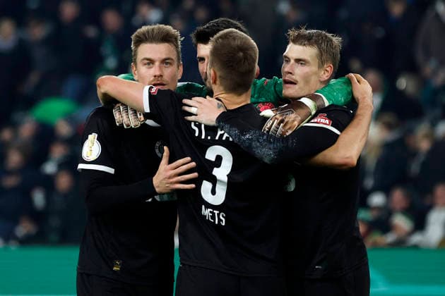 Mönchengladbach, Germany, Germany DFB Pokal Round of 16 Borussia Mönchengladbach FC St Pauli 1 2 Hauke Finn WAHL STP , goalkeeper Nikola VASILJ STP , Karol METS STP and Eric SMITH STP from left to right celebrate the victory Photo Norbert Schmidt, Duesseldorf