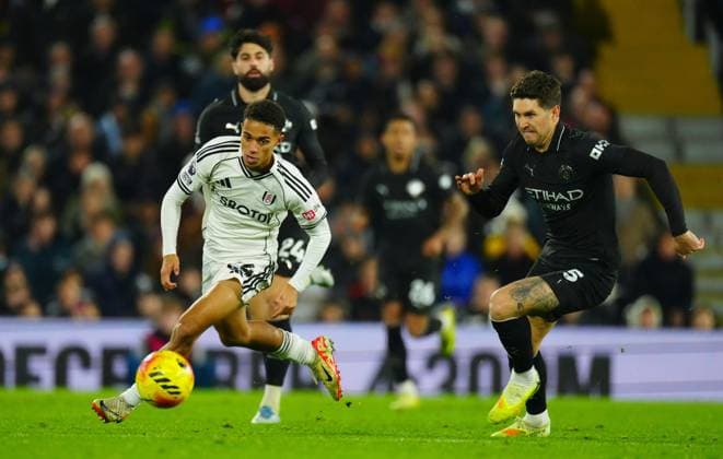 Josh King of Fulham chased by John Stones of Manchester City Fulham v Manchester City, Premier League, Football, Craven Cottage, London, UK - 02 Dec 2025London Craven Cottage United Kingdom EDITORIAL USE ONLY No use with unauthorised audio, video, data, fixture lists, club league logos or live services. Online in-match use limited to 120 images, no video emulation. No use in betting, games or single club league player publications.  Copyright: xJavierxGarcia Shutterstockx 16005566fe