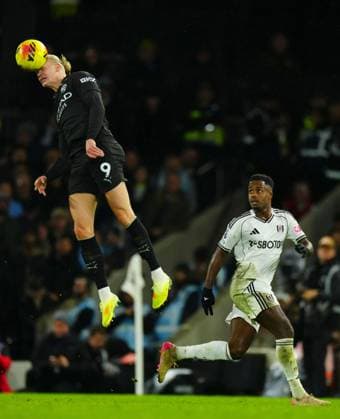 Erling Haaland of Manchester City heads as Ryan Sessegnon of Fulham looks on Fulham v Manchester City, Premier League, Football, Craven Cottage, London, UK - 02 Dec 2025London Craven Cottage United Kingdom EDITORIAL USE ONLY No use with unauthorised audio, video, data, fixture lists, club league logos or live services. Online in-match use limited to 120 images, no video emulation. No use in betting, games or single club league player publications.  Copyright: xJavierxGarcia Shutterstockx 16005566fq
