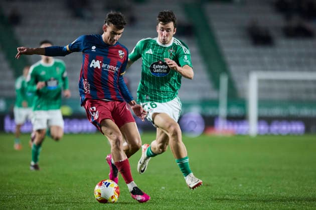 Racing Club Ferrol v SD Huesca - Copa del Rey FERROL, SPAIN - DECEMBER 2: Angel Perez of SD Huesca competes for the ball with Aitor Gelardo of Racing Club de Ferrol during the Copa del Rey second round match between Racing Club Ferrol and SD Huesca at Campo Municipal A Malata on December 2, 2025 in Ferrol, Spain. (Photo by Diego Simon Photo Players Images Magara Press) Ferrol Estadio Municipal A Malata Spain Copyright: xDiegoxSimonx