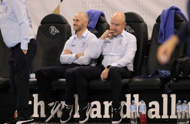 photo smalltalk before kick-off , Physiotherapist Alain Carmand , left next to him Co Coach Baptiste Nicot Handball Men on Tue 02 12 2025 Euroleague Mens EHF EURO LEAGUE , Tue 02 12 25 THW Kiel Montpellier HB