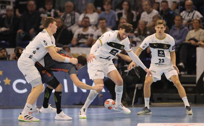 photo Kyllian VILLEMINOTT Montpellier against Domagoj Duvnjak , Rune Dahmke right and Lukas LAUBE Kiel , left Handball Men on Tue 02 12 2025 Euroleague Mens EHF EURO LEAGUE , Tue 02 12 25 THW Kiel Montpellier HB