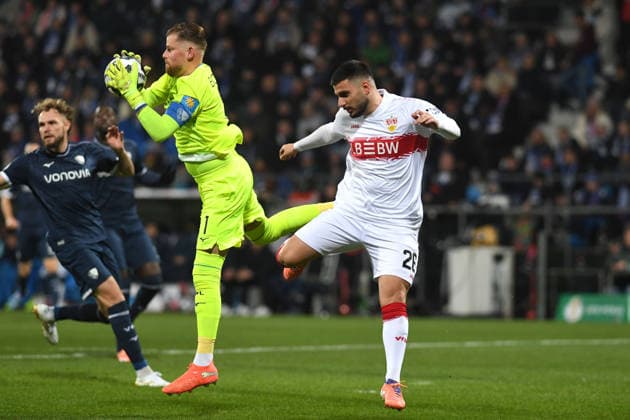 Goalkeeper Timo Horn VfL Bochum and Deniz Undav VfB Stuttgart in a duel during the DFB Pokal match between VfL Bochum v VfB Stuttgart, Vovovia Ruhrstadion on December 03, 2025 in Bochum, Germany Photo by Ralf Treese DeFodi Images Goalkeeper Timo Horn VfL Bochum and Deniz Undav VfB Stuttgart battle for the ball during the DFB Pokal match between VfL Bochum v VfB Stuttgart at Vonovia Ruhrstadion on December 3, 2025 in Bochum, Germany Photo by Ralf Treese DeFodi Images Photo by Ralf Treese DeFodi Images