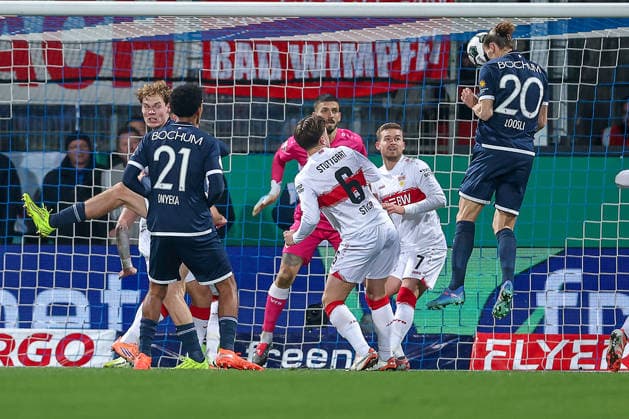 02 12 2025, Football, DFB Cup, , Season 2025 2026 Header Noah Loosli VfL Bochum 20 in the penalty area in a duel against Angelo Stiller VfB Stuttgart 06 Maximilian Mittelstädt VfB Stuttgart 07 DFB regulations prohibit any use of photographs as image sequences and or quasi video North Rhine-Westphalia Germany