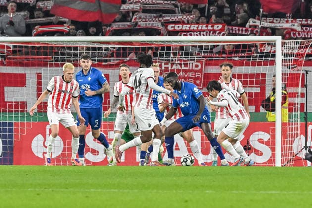Patric Pfeiffer SV Darmstadt 98, 06 on the ball and in a duel with Yuito Suzuki SC Freiburg, 14 , Johan Manzambi SC Freiburg, 44 GER, SC Freiburg SV Darmstadt 98, Football, DFB Cup, Round of 16, Season 2025 2026, 03 12 2025 DFB REGULATES PROHIBIT ANY USE OF PHOTOGRAPHS AS IMAGE SEQUENCES AND OR QUASI VIDEO GER, SC Freiburg SV Darmstadt 98, Football, DFB Pokal, Round of 16, Season 2025 2026, 03 12 2025 Freiburg Copyright: xEibner-Pressefoto ThomasxHessx EP_THS