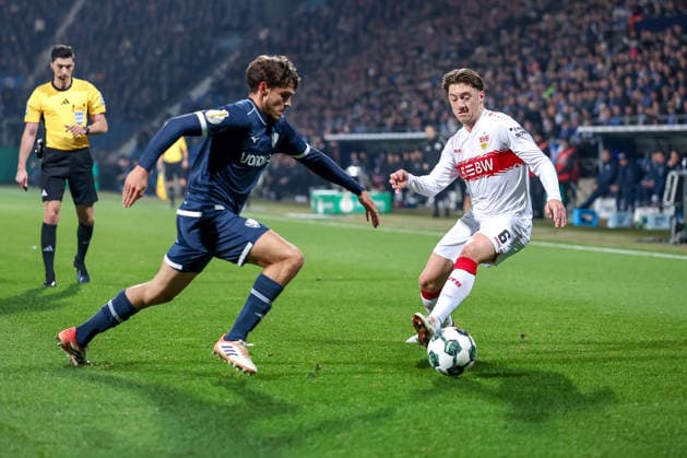 02 12 2025, Football, DFB Cup, Achtelfinale, Season 2025 2026 Cajetan Lenz VfL Bochum 34 in a duel against Angelo Stiller VfB Stuttgart 06 DFB regulations prohibit any use of photographs as image sequences and or quasi video North Rhine-Westphalia Germany