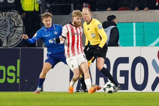 Luca Marseiler SV Darmstadt , 08 and Niklas Beste SC Freiburg, 19 in duel , Germany, Soccer, DFB Cup, Round of 16, 2025 2026, SC Freiburg vs SV Darmstadt 98, 03 12 2025, Europa Park Stadion , Freiburg im Breisgau, Germany Freiburg im Breisgau Europa Park Stadion Baden Wuerttemberg Germany Copyright: xGrantxHubbsx