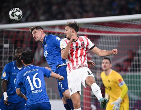 Football DFB Cup round of 16 2025 2026 03 12 2025 SC Freiburg SV Darmstadt 98 Max Rosenfelder right, SC Freiburg against Matej Maglica center, SV Darmstadt 98 and Hiroki Akiyama left, SV Darmstadt 98