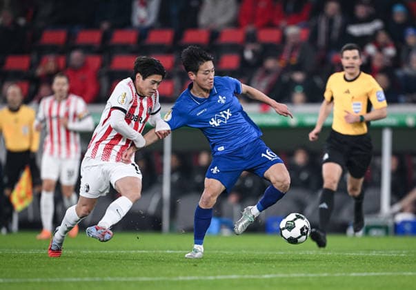 Football DFB Cup round of 16 2025 2026 03 12 2025 SC Freiburg SV Darmstadt 98 Yuito Suzuki left, SC Freiburg v Hiroki Akiyama right, SV Darmstadt 98