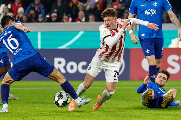 Foul on Philipp Treu SC Freiburg, 29 by Hiroki Akiyama SV Darmstadt , 16 leading to penalty kick , Germany, Football, DFB Pokal, Round of 16, 2025 2026, SC Freiburg vs SV Darmstadt 98, 03 12 2025, Europa Park Stadion , Freiburg im Breisgau, Germany Freiburg im Breisgau Europa Park Stadion Baden Wuerttemberg Germany Copyright: xGrantxHubbsx