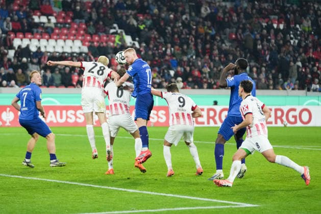 DFB Pokal SC Freiburg vs SV Darmstadt 98, 03 12 2025 Header duel between Matthias Ginter SC Freiburg, 28 and Kai Klefisch SV Darmstadt 98, 17 DFB Pokal SC Freiburg vs SV Darmstadt 98, Europa Park Stadion, 03 12 2025 DFB DFL REGULATIONS PROHIBIT ANY USE OF PHOTOGRAPHS AS IMAGE SEQUENCES AND OR QUASI VIDEO Copyright: xBEAUTIFULxSPORTS Boscox