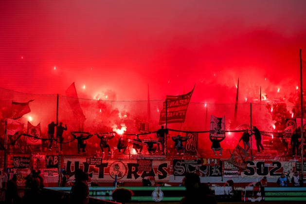 03 12 2025, Football, DFB Cup, VfL Bochum VfB Stuttgart, Round of 16, Vonovia Ruhrstadion, Season 2025 2026 Ultras fans in the visitors block cause the game to be interrupted by the use of pyrotechnics in the visitors block Dense smoke and fog drifts onto the pitch Choreography Choreo Choreography Bengal fire Bengalos Fireworks DFB regulations prohibit any use of photographs as image sequences and or quasi video North Rhine-Westphalia Germany