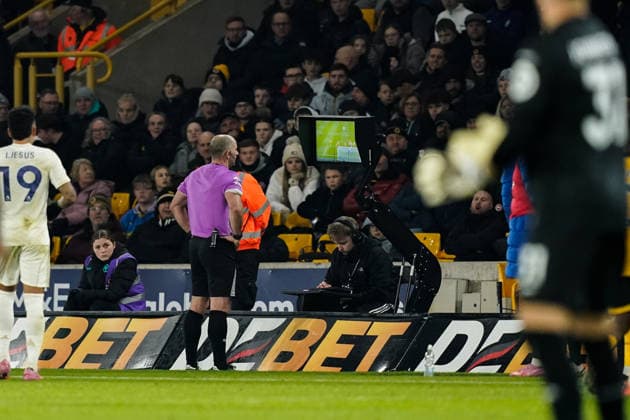 Wolverhampton, England, 3rd December 2025. Referee Tim Robinson goes over to the VAR screen following the goal from Igor Jesus of Nottingham Forest to make it 0-1 during the Wolverhampton Wanderers vs Nottingham Forest Premier League match at Molineux, Wolverhampton. Picture credit should read: Andrew Yates Sportimage EDITORIAL USE ONLY. No use with unauthorised audio, video, data, fixture lists, club league logos or live services. Online in-match use limited to 120 images, no video emulation. No use in betting, games or single club league player publications. SPI_034_AY_WOL_vs_NFO SPI-4341-0034