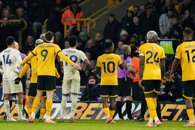 Wolverhampton, England, 3rd December 2025. Players of both teams look at the VAR screen after the goal from Igor Jesus of Nottingham Forest during the Wolverhampton Wanderers vs Nottingham Forest Premier League match at Molineux, Wolverhampton. Picture credit should read: Andrew Yates Sportimage EDITORIAL USE ONLY. No use with unauthorised audio, video, data, fixture lists, club league logos or live services. Online in-match use limited to 120 images, no video emulation. No use in betting, games or single club league player publications. SPI_035_AY_WOL_vs_NFO SPI-4341-0035