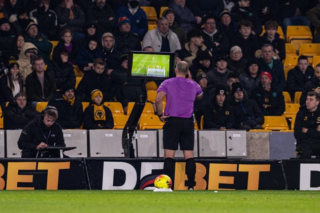 3rd December 2025; Molineux Stadium, Wolverhampton, West Midlands, England; Premier League Football, Wolverhampton Wanderers versus Nottingham Forest; Referee Tim Robinson consults the VAR screen and rules out the goal for offside  GodfreyxPitt
