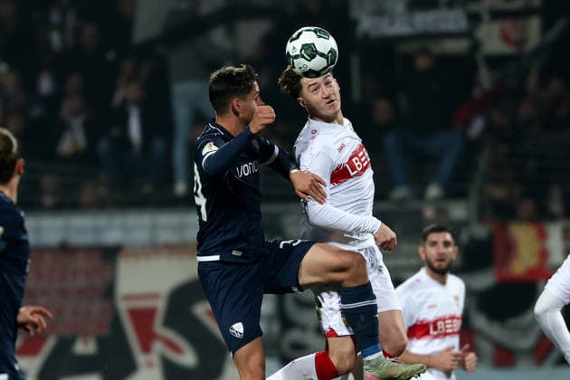 Bochum, Vonovia Ruhrstadion, 03 12 25, GER, Men, DFB Cup, Round of 16, Season 2025 2026, VfL 1848 Bochum VfB Stuttgart, Cajetan Lenz VfL Bochum and Angelo Stiller VfB Stuttgart in a duel, DFB DFL REGULATIONS PROHIBIT ANY USE OF PHOTOGRAPHS AS IMAGE SEQUENCES AND OR QUASI VIDEO Copyright: JoachimxBywaletz xJB-Sportfoto