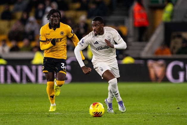 3rd December 2025; Molineux Stadium, Wolverhampton, West Midlands, England; Premier League Football, Wolverhampton Wanderers versus Nottingham Forest; Callum Hudson-Odoi of Nottingham Forest runs past Mateus Mane of Wolverhampton Wanderers  GodfreyxPitt