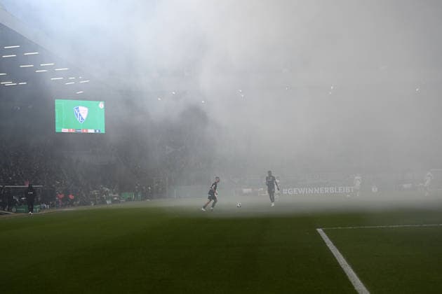 Dense smoke after pyrotechnics, pyro, smoke bomb, incendiary flare, flare, delays the second half, feature, symbol photo, border motif, football, DFB Cup, Round of 16, Round of 16, VfL Bochum BO VfB Stuttgart S 0 2 am 03 12 2025, Vonovia Ruhrstadion Bochum Germany DFL regulations prohibit any use of photographs as image sequences and or quasi video Â
