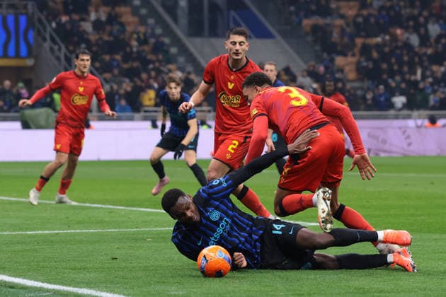 Milan, Italy, 3rd December 2025. Joel Schingtienne of Venezia FC clashes with Ange-Yoan Bonny of FC Internazionale in the penalty area during the Internazionale vs Venezia Coppa Italia match at Giuseppe Meazza, Milan. Picture credit should read: Jonathan Moscrop Sportimage EDITORIAL USE ONLY. No use with unauthorised audio, video, data, fixture lists, club league logos or live services. Online in-match use limited to 120 images, no video emulation. No use in betting, games or single club league player publications. SPI_102_JM_INTER_VENEZIA_CI SPI-4321-0100