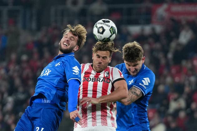 Killian Corredor SV Darmstadt 98, 34 , Lucas Höler Lucas Hoeler SC Freiburg, 09 , Matej Maglica SV Darmstadt 98, 05 fighting for the ball , Football, Round of 16, DFB Pokal, 2025 26, SC Freiburg vs SV Darmstadt 98, 03 12 2025, Europa Park Stadion, Freiburg, Germany DFB REGULATIONS PROHIBIT ANY USE OF PHOTOGRAPHS AS IMAGE SEQUENCES AND OR QUASI VIDEO Freiburg Europa Park Stadion Baden Württemberg Germany Copyright: xArnexAmbergx
