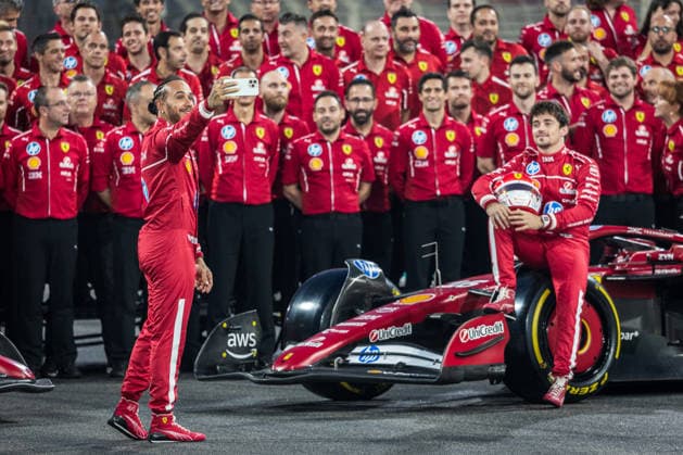Yas Marina Circuit, Abu Dhabi, United Arab Emirates 4.December.2025; Lewis Hamilton of Great Britain takes selfie during Scuderia Ferrari end of the year team photo Formula One Abu Dhabi Grand Prix  aflo_312476804