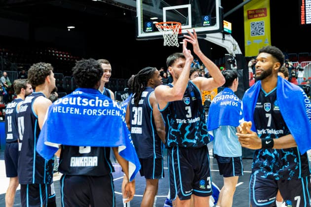 04 12 2025, xomx, Basketball EuroCup, Niners Chemnitz Turk Telekom v l Final score 63 87 Cheers for the guests BERKAN DURMAZ Turk Telekom Ankara , KYLE ALEXANDER Turk Telekom Ankara Chemnitz