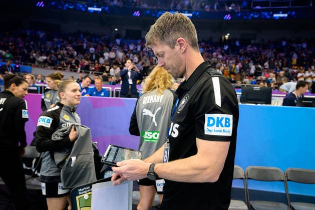 Handball, Womens World Championship, Main Round Montenegro Germany Coach Markus Gaugisch Germany looks at the data on the tablet Dortmund Westfalenhalle North Rhine-Westphalia Germany